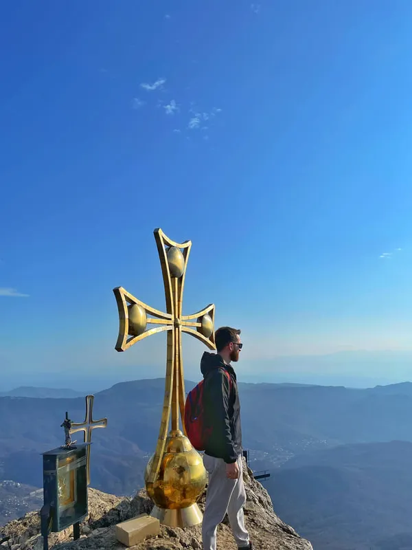 Hiker At The Crosses Of Tskhrajvari 2 days of pure hike – a group tour from Tbilisi