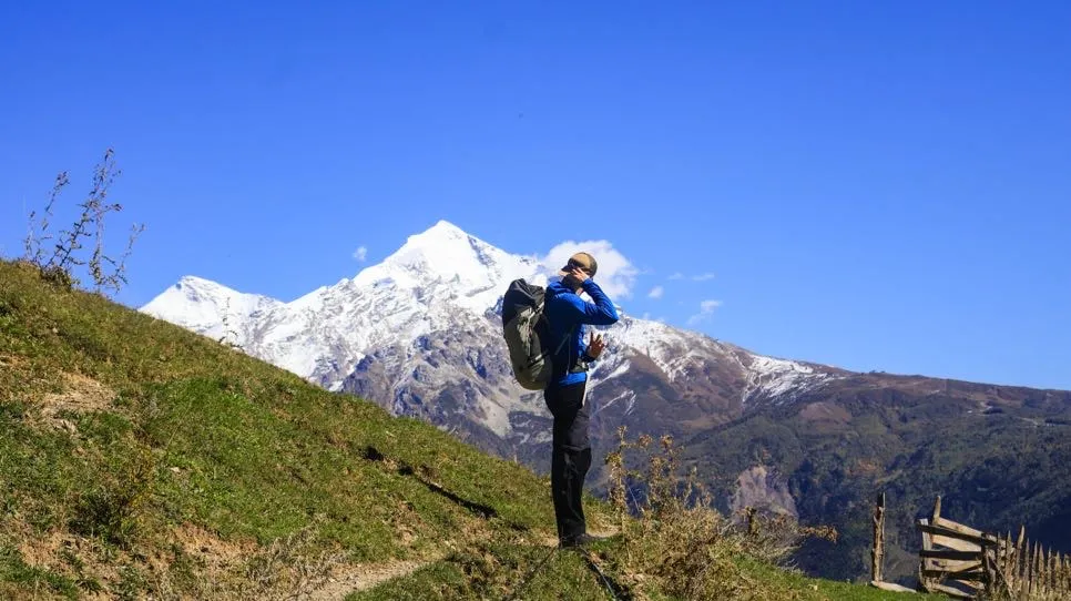 Hiker On The View Of Tetnuldi 2 Mestia-Ushguli trek – 5 days tour from Batumi