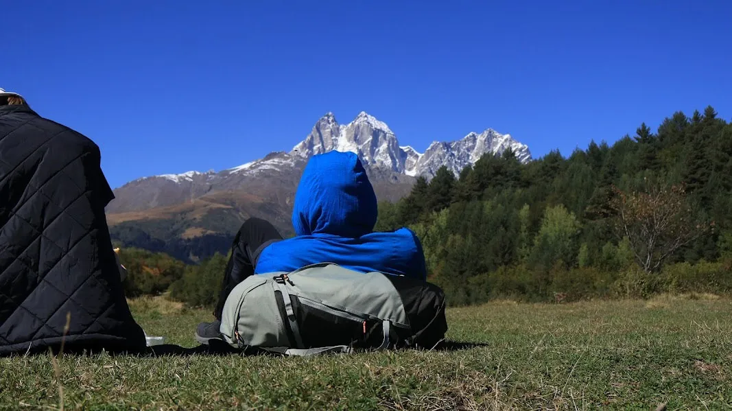 Hiker On The View Of Ushba 2 Mestia-Ushguli trek – 5 days tour from Batumi