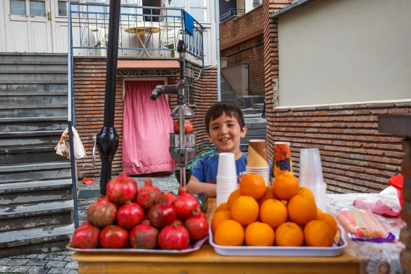 Salesman Boy In Tbilisi 4 Vardzia, Tbilisi & Kazbegi – 3 days tour from Kutaisi to Eastern Georgia